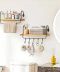 Legit Pine Wood Floating Wall Shelves With Ten Adjustable Mug Hooks For Your Best Coffee Bar Setup Yet Rustic Industrial Brackets And Heavy Duty Storage Rack Totally Kick Up Your Kitchen Or Bathroom Walls. Floating shelf with towels and decorative items.
