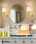 Gold Cordless Wall Sconces Set Of Two Battery Operated Rechargeable Dimmable Led Lamps With Fabric Shades illuminating a bathroom mirror.