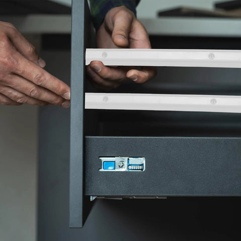 Installation of Rock Solid 12 Inch Side Mounted Plastic Drawer Slides In Crisp White, showcasing smooth gliding in cabinet.