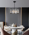 Crystal Drum Chandelier For Dining Room And Kitchen Island, 6-light K9 crystal, black finish over round dining table setup.