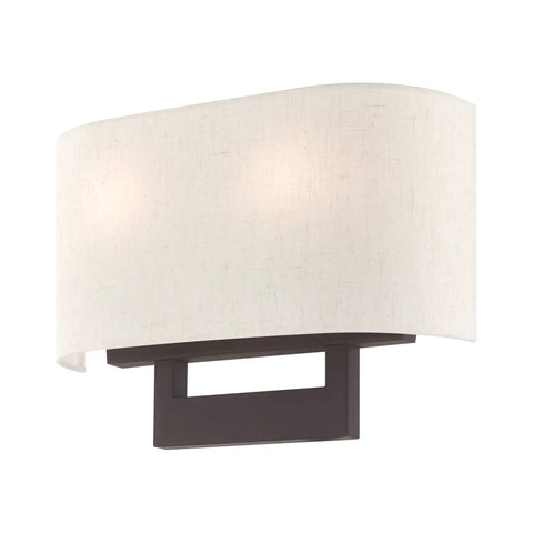 Bronze Wall Sconce With Contemporary Design, featuring a bronze base and oatmeal fabric shade, perfect for modern living spaces.