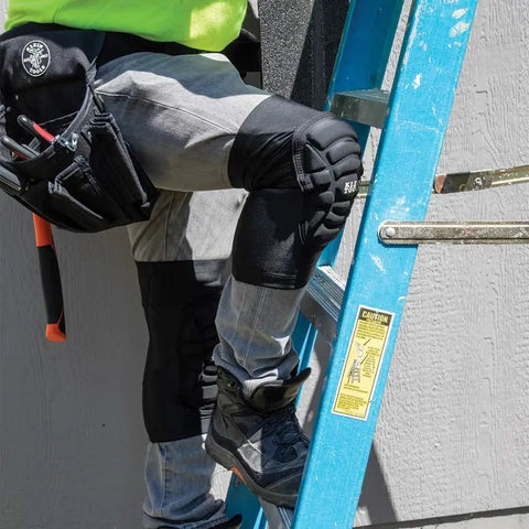 All Day Comfort Lightweight Knee Pads With Padded Sleeves Breathable Mesh Back Elastic Cuff And Slip Resistant Silicone Low Profile Fit For Tight Spaces Worksite Ready Black Medium Large being worn by worker on ladder