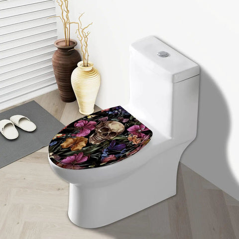 Elongated Resin Toilet Seat for Bathroom with floral skull design, fitting on a standard toilet bowl.