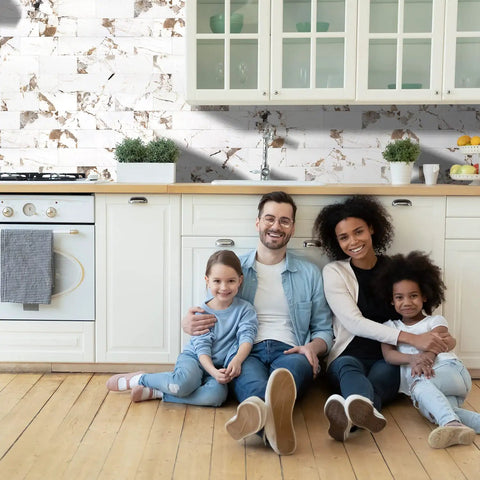 Smiling family in kitchen with 10 Sheet Subway Tile Peel And Stick Backsplash Kit With Self Adhesive PVC Tiles In Star White Marble
