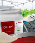 Grow Fertilizer For Hydroponics And Soil Water Soluble Veg Nutrients For Tomatoes Leafy Greens Herbs And Other Fast Growing Plants In Greenhouses For Year Round Growth, packet in greenhouse.