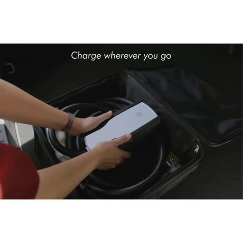 Person placing Level 2 EV Charger 7.6kW Plug-and-Play Home Charger With Dual Voltage 120V/240V in a bag