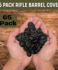 Hands holding 65 pack of black All Weather Rifle Barrel Cover For Most Guns Muzzle Protection Keeps Your Rifle Clean And Ready Fits Bolt Action Muzzleloader Shotgun And More Durable Gun Barrel Shield That Reduces Malfunctions And Weatherproofs Your Muzzle