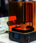 No Nonsense Heavy Duty Orange Laser Safety Shield Featuring Solid Optical Density Filter Blocking Harmful Ultraviolet And Blue Light Up To Five Forty Nm For Pro Shop Applications displayed on a laser machine.