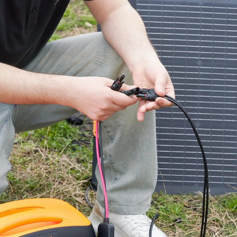 Person using 6-In-1 Solar Connector Kit With Female And Male Connectors, Universal Solar Adapter Cable for Solar Panels outdoors
