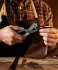 Person using Heavy Duty 9 Inch Leather Hole Punch Tool Rotary Belt Hole Puncher With Ergonomic Non Slip Handle to punch leather.