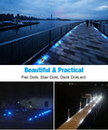 12 Pack Solar LED Driveway Lights Two Color Options White Or Blue illuminating a waterfront pathway at dusk with city skyline