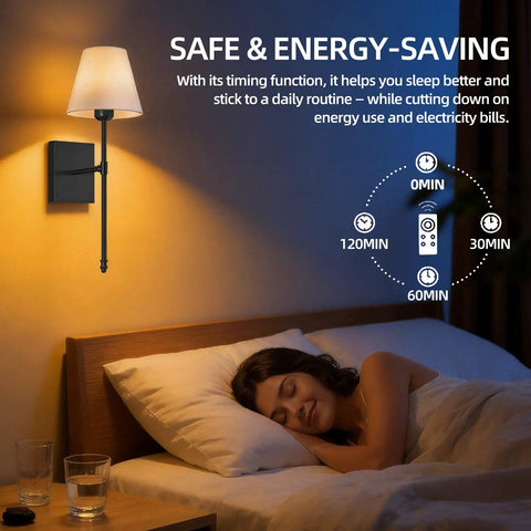 Set Of 2 Battery Powered Wall Sconces No Wiring Needed With Black Fabric Shade Remote Control Dimmable RGB Color Changing Wall Lamp For Bedroom Living Room Hallway 20 Inches Tall. Image features a lamp mounted beside a bed with a sleeping person.
