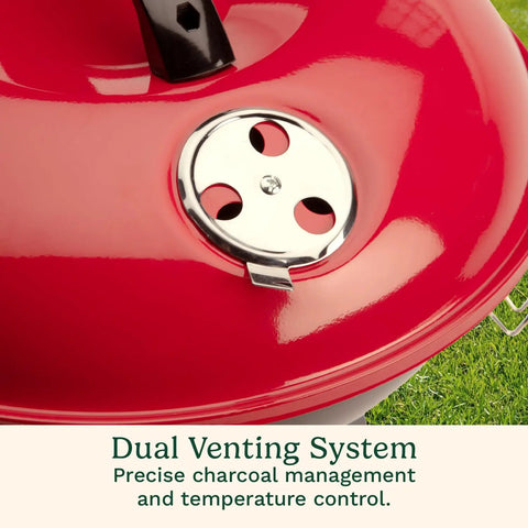 Close-up of a red 14 Inch Portable Charcoal Grill with Locking Lid and Dual Vents Lightweight Tabletop BBQ.