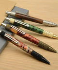 Set Of 5 DuraClick EDC Ballpoint Pen Woodturning Kits with varied pen designs on wooden surface.