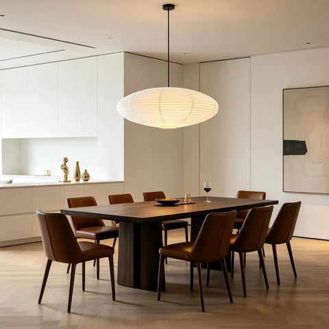 20 Inch Oval Paper Lantern Pendant Light White Rice Paper Ceiling Lamp Japanese Style diffused glow over a modern dining table.