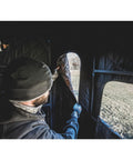 Person inside Beefy 10 Foot Powder Coated Steel Hunting Tower With 360 Soft Sided Blind adjusting window cover for a stealth view.