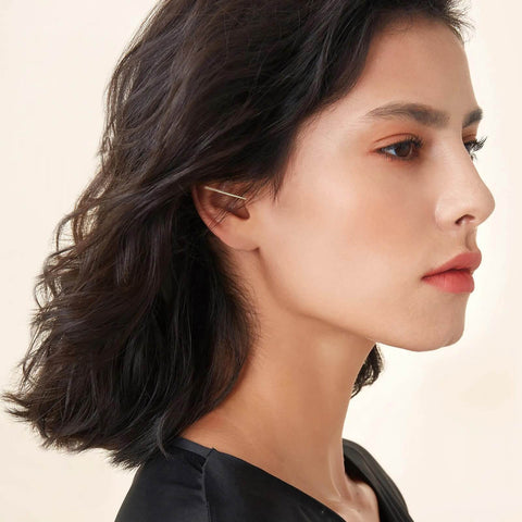 Side profile of a person with an ear piercing using the Stainless Steel Piercing Taper Ball Grabber Kit for Easy Jewelry Swap.