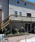 House with 101 Pack Stainless Steel Deck Balusters 36-Inch Black Side Mount Railing With End Caps And Screws