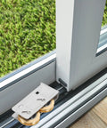 Get Your Track Setup Running Like Butter With These Heavy Duty Sliding Door And Window Pulleys Crafted From Premium Stainless Steel And Fitted With Dual Copper Wheels For Effortless Everyday Glide, showing silver pulleys on a sliding door track.