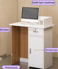 Close-up of No Drama Adjustable Standing Desk With Slick Reception Counter For Offices showing lockable drawers and thick panels.