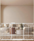 Extra Wide Pressure Mount Baby Gate Auto Close With Walk Through, white metal safety gate in living room doorway