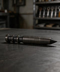 Heavy Duty Center Punch Locator For Metal Drilling high hardness spot punch tool resting on a metal surface, showing sharp tip.