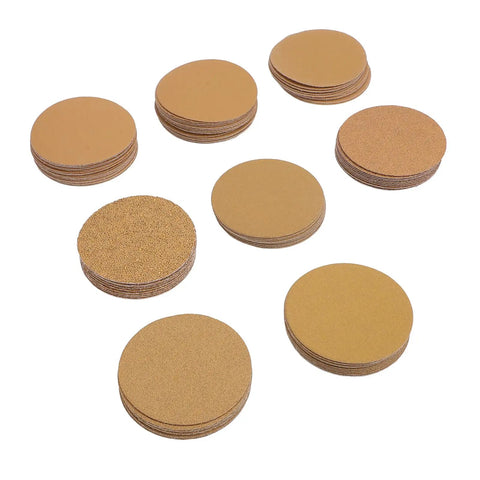 Top Tier 3 Inch Gold Aluminum Oxide Hook And Loop Sanding Discs With Hook Back For Orbital Sanders Smooth Woodwork Auto Body Metal Wall Finishing Pack Of One Hundred Sheets Durable Heavy Duty Abrasive Tool, various grits visible.