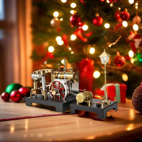 Steam Engine Model Kit With Boiler And Lamp Scene beside a decorated Christmas tree on a wooden table.
