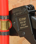 Close-up of All-In-One PEX Crimp Tool Kit for One Half And Three Quarter Inch Copper Crimp Rings in use on PEX tubing.