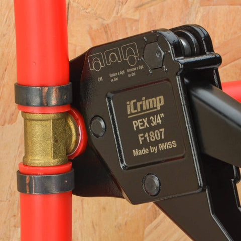 Close-up of All-In-One PEX Crimp Tool Kit for One Half And Three Quarter Inch Copper Crimp Rings in use on PEX tubing.
