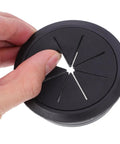 20 Piece Desk Cable Grommet Kit For Office Desks With Slick Black And White Wire Hole Covers Easy No Tool Install Conceal Cables On Your Computer Desk Plastic Grommets And Plugs For A Clean Tidy Pro-Grade Workspace black plastic desk cable grommet held by hand