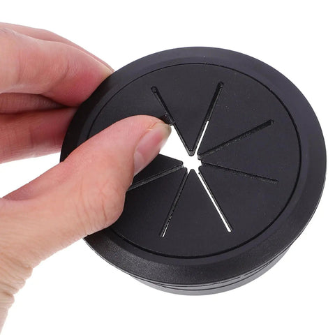 20 Piece Desk Cable Grommet Kit For Office Desks With Slick Black And White Wire Hole Covers Easy No Tool Install Conceal Cables On Your Computer Desk Plastic Grommets And Plugs For A Clean Tidy Pro-Grade Workspace black plastic desk cable grommet held by hand