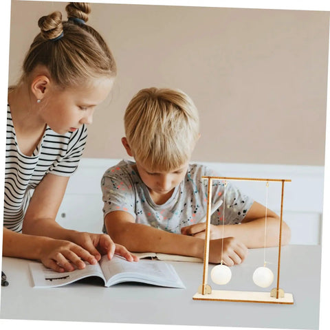 Children using Hands On Physics Experiment Tools Kit With Floating Ball For Students Fun Science Gear to learn STEM at home.