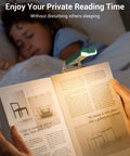 USB Rechargeable Clip On Book Light For Late Night Reading illuminating page with sleeping child in background
