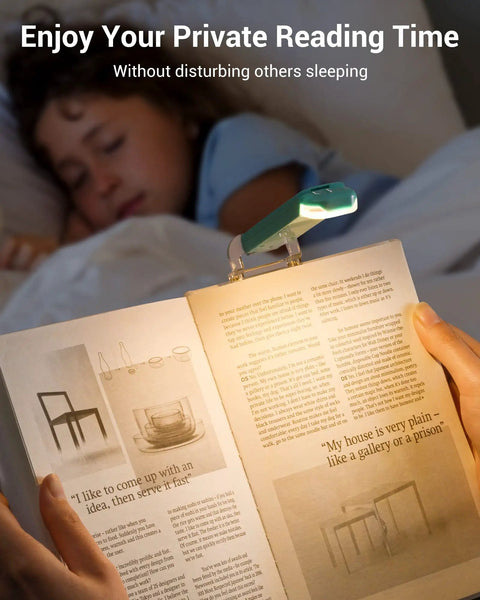 USB Rechargeable Clip On Book Light For Late Night Reading illuminating page with sleeping child in background