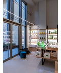 Effortlessly Sleek Modern Linear LED Wall Sconces With Remote Control For Cozy Bedroom And Living Room Vibes A Total Game Changer For Your Glow Up In Black Finish Dimmable Lighting in a stylish modern interior with shelves and plants.