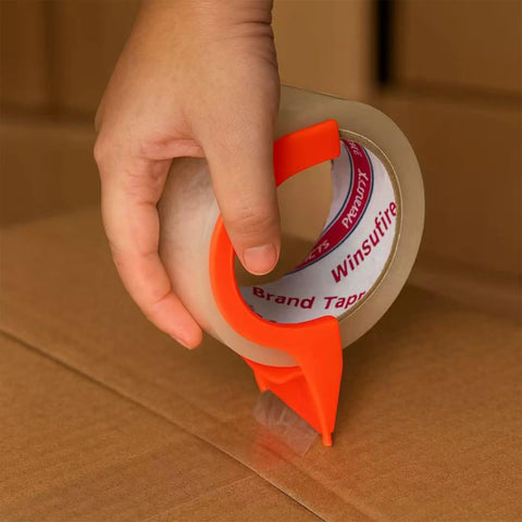 Person using dispenser with heavy duty packing tape for shipping and moving, 1.88 inch wide by 65 yards per roll, showing strong hold.