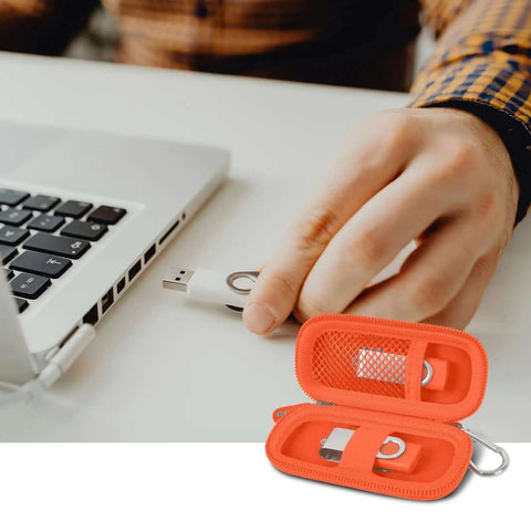 Dang Solid USB Flash Drive Case Plus SD Card Holder Bag For Thumb Drives with orange sleeve and USB drive in use.