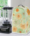 Cute Green Daisy Print Blender Dust Cover with Fingerprint Protection on kitchen counter next to black blender