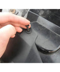 Hella Tough Nylon Bumper Fastener Rivet Clips One Hundred Piece Assortment Kit Eight Mm Universal Push Pin Anchors in use with a hand inserting a clip.