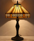 Yellow Hexagon Tiffany Style Stained Glass Lamp For A Cozy Vibe Mission Table Desk Bedside Reading Light 12 Inch Shade 18 Inch Tall With Antique Green Bronze Base UL Listed Cord Switch Perfect For Bedroom Or Living Room Decor glowing softly in dimly lit room