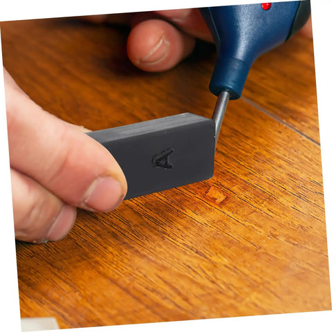 Close-up of Wood Floor And Furniture Repair Kit With Durable Wax Blocks For Quick Scratch Fixes On Hardwood Laminate And Porcelain Tile Surfaces Pro Grade Diy Friendly Restoration Tool in use.