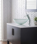 Tall Waterfall Vessel Sink Faucet With Frosted Glass Disk In Chrome Finish in modern bathroom setting
