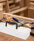 Grab And Go Portable Plastic Toolbox With Handle, Large Capacity Craft And Hardware Organizer on a workbench with tools.