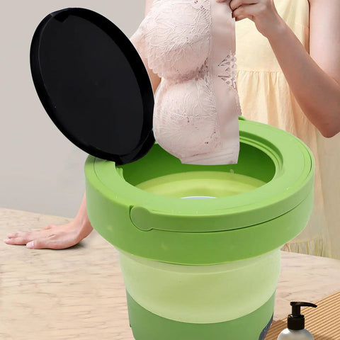 Portable Mini Washing Machine 6 Liter Foldable Compact Cleaner with lid, washing a pink bra for travel-friendly use.