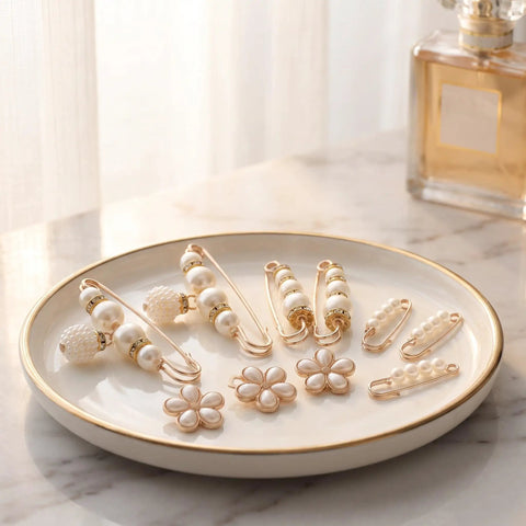 Ditch Tailor Bills And Snag These Pearl Pin Style Waist Tightening Clips For Jeans Dresses And Sweaters arranged on a plate.