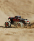 Quake GROM 4x4 RC Monster Truck One Sixteenth Scale Ready To Roll With Battery And Charger Included Brushed Power Red High Traction Drivetrain For Rough Terrain driving on dirt