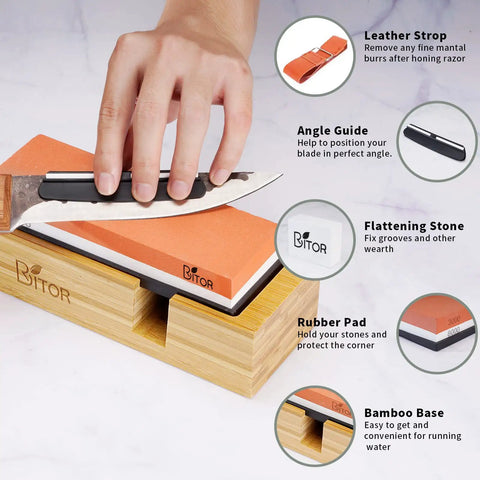 Hand using Pro Knife Sharpening Stone Kit with Dual-Sided Whetstones 400/1000 and 3000/8000 on non-slip bamboo base with angle guide.