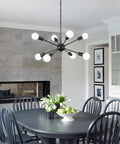 Black chandelier with 8 lights in modern kitchen, highlighting dining area beneath chandelier