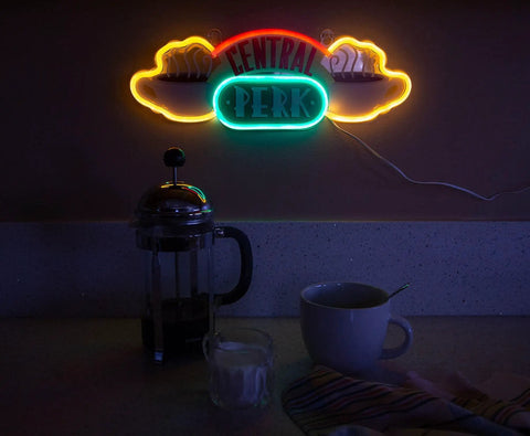 Central Perk Neon Light Wall Sign 16 Inch Replica Coffee Shop LED Hanging Decor glowing on wall above coffee setup